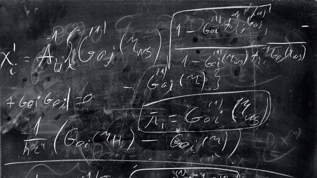 Physicist studying quantum computing equations on a whiteboard exploring simulation theory